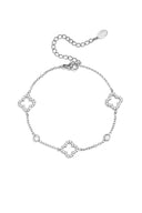 Armband met opengewerkte en belegde klavers en steentjes